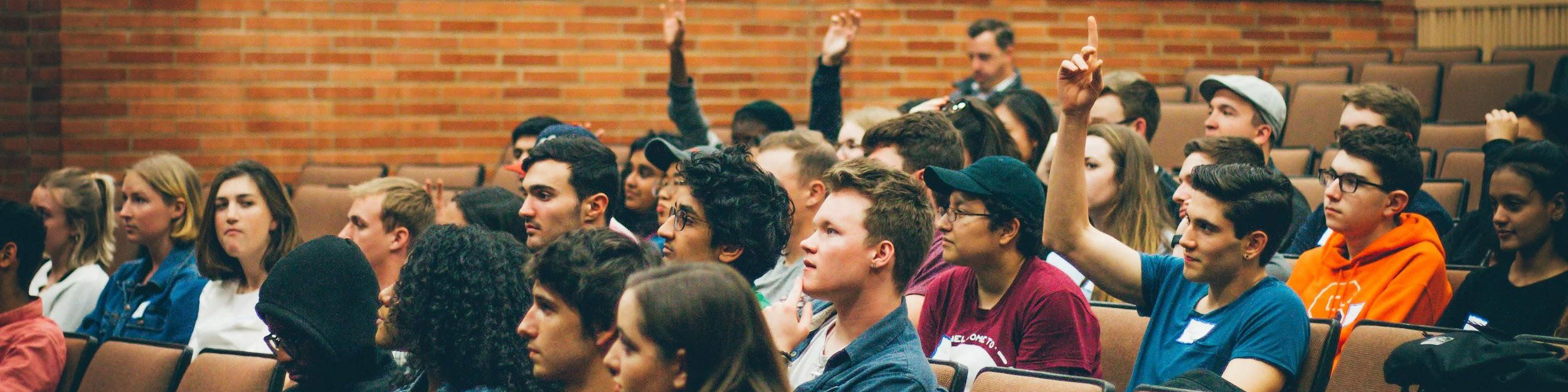 students gathered in auditorium asking questions