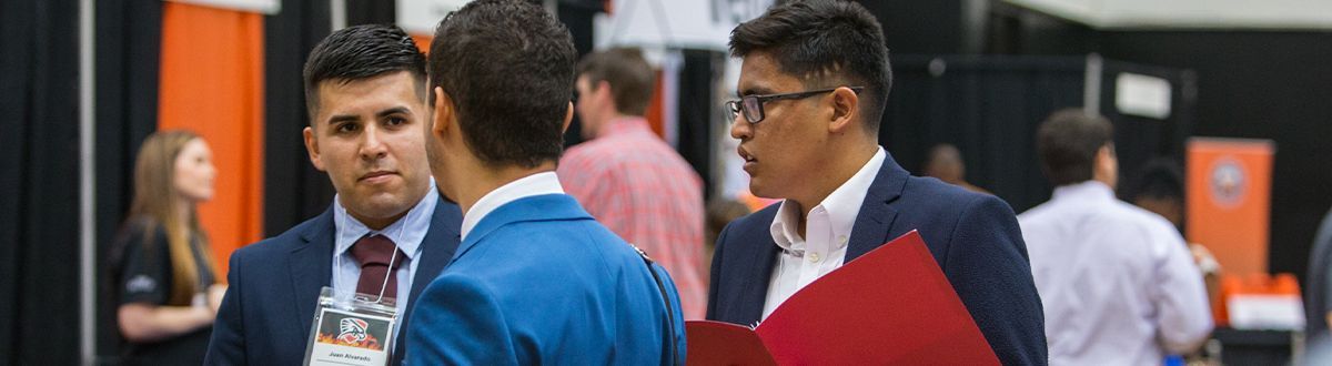 Business students talking at a presentation conference