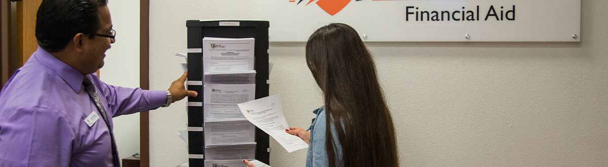 financial aid employee helping a student