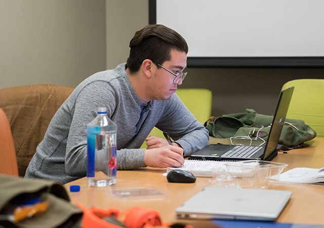 Guy on a laptop in a lab