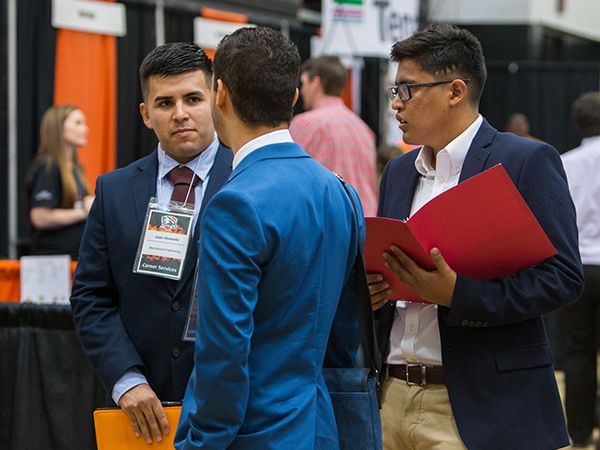 Students mingling at job fair