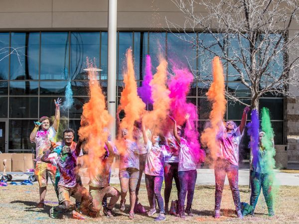 student activities - glow powder blowing up on a group