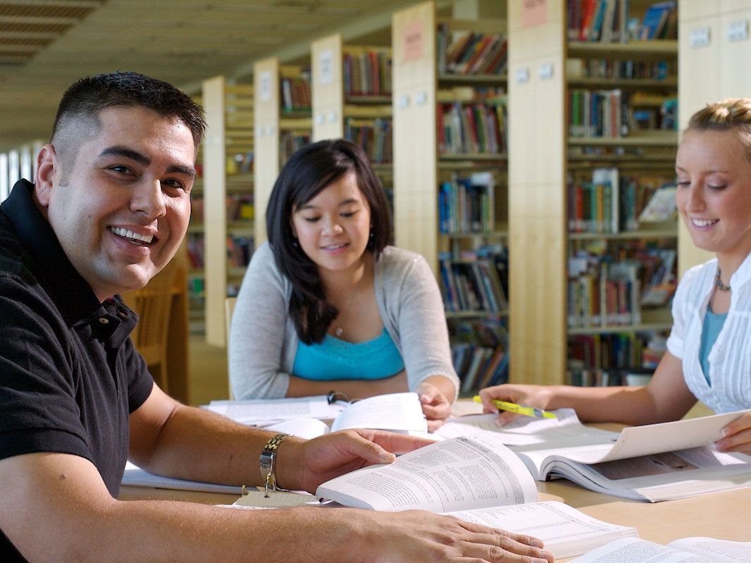 students in a study group in the library