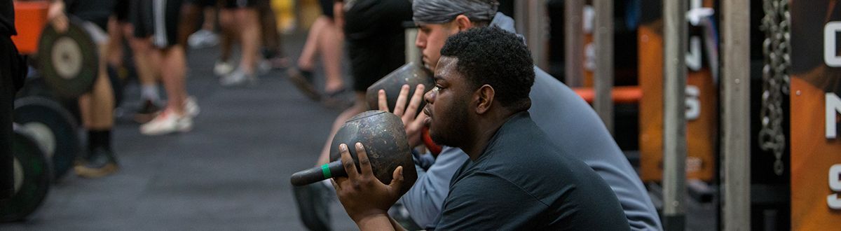 athletes lifting weights