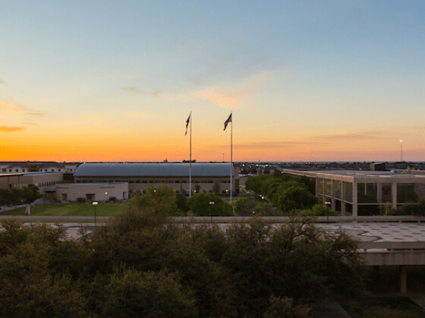 sun setting over campus