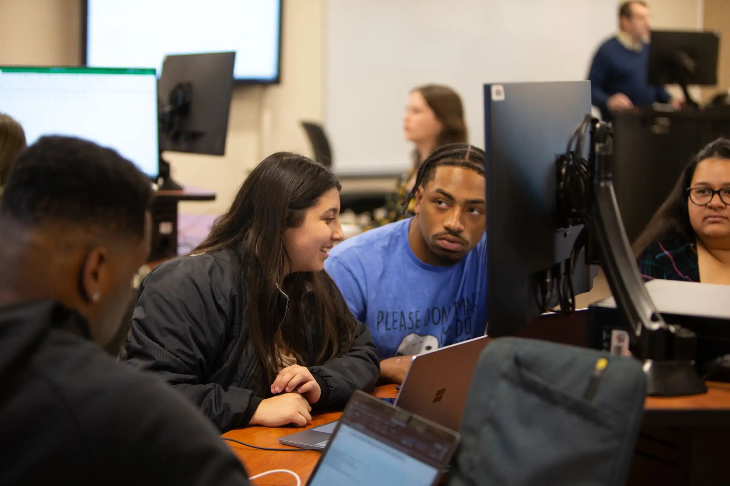 Students in UTPB's MBA program attend a business class, engaging with faculty and course material in a collaborative classroom setting.