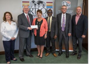Image of Dr. Woodley receiving check from Ortloff