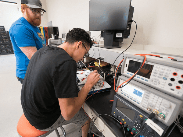 student in electrical engineering classroom