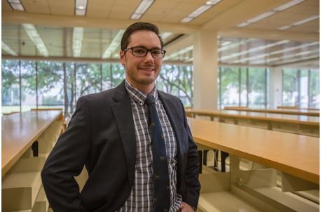 Image of Steven Lively standing in the library