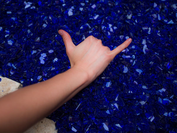 Falcons Up Hand Sign on the blue zen garden rocks