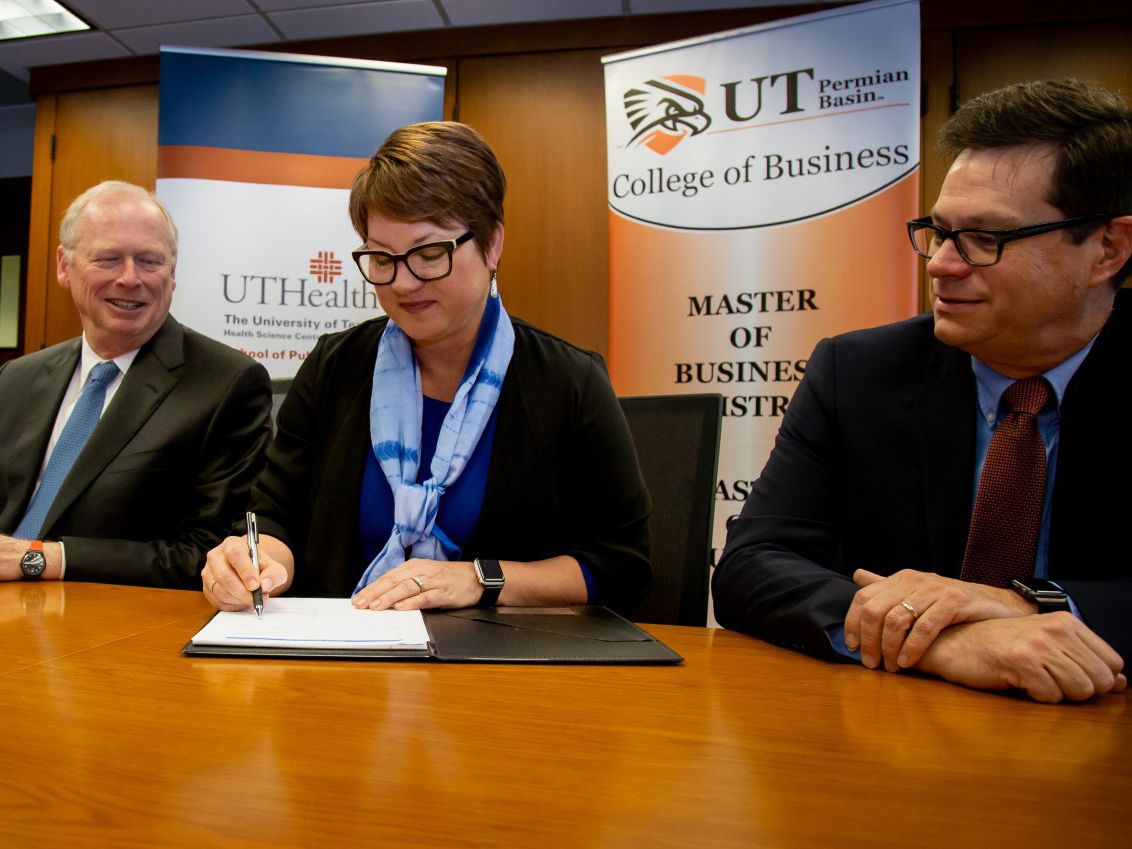 Dr. Woodley signs partnership agreement with UTHealth