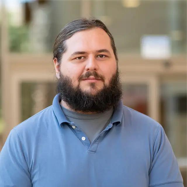 Robert Funderburg posing professionally for in his headshot