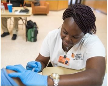 Image of College of Nursing Student giving an injection