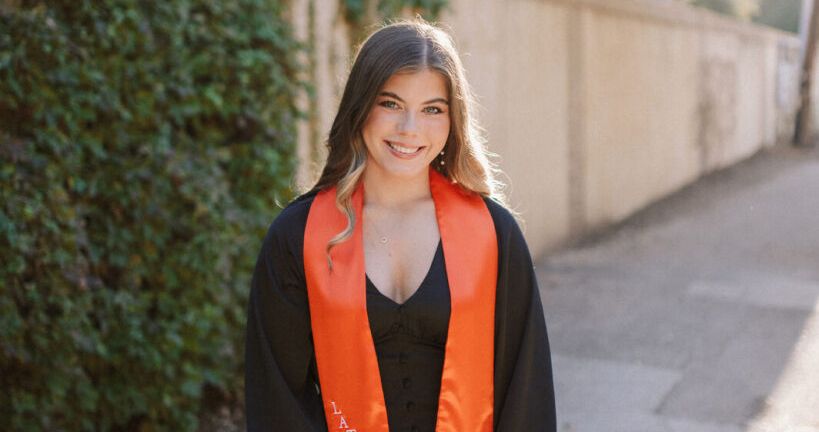 Ellenie Richardson smiling for graduation photos 