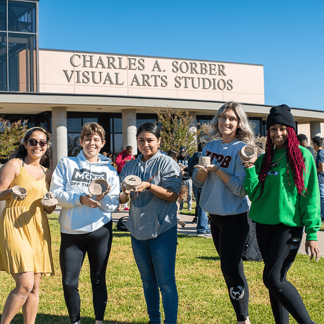 students in front of visual arts center