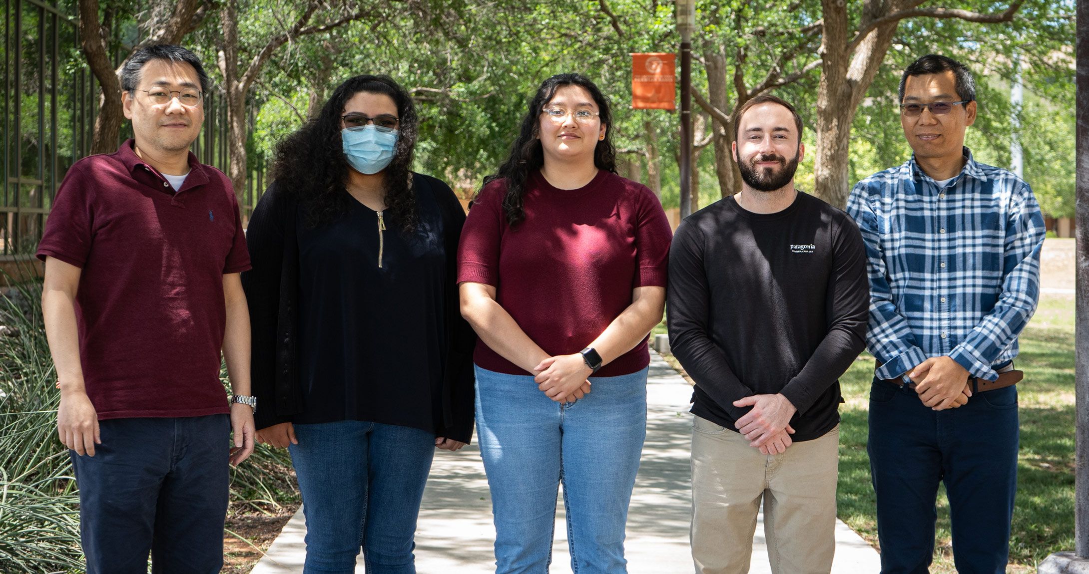 Students in cohort smile together 