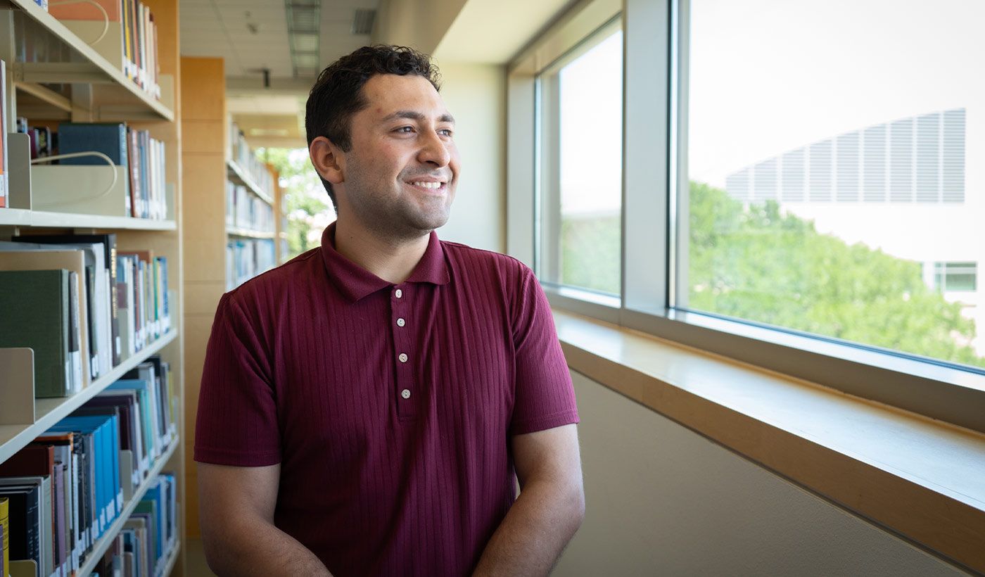 Daniel Jurado posing in library 