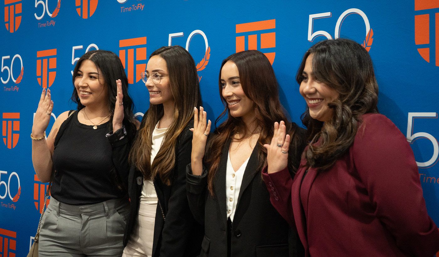 Students posing with order of engineer rings