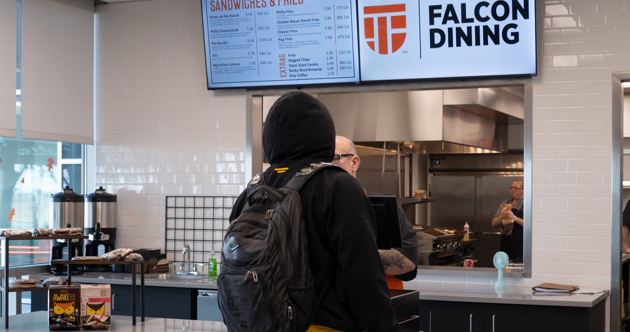 Student orders food at Catalyst Cafe 