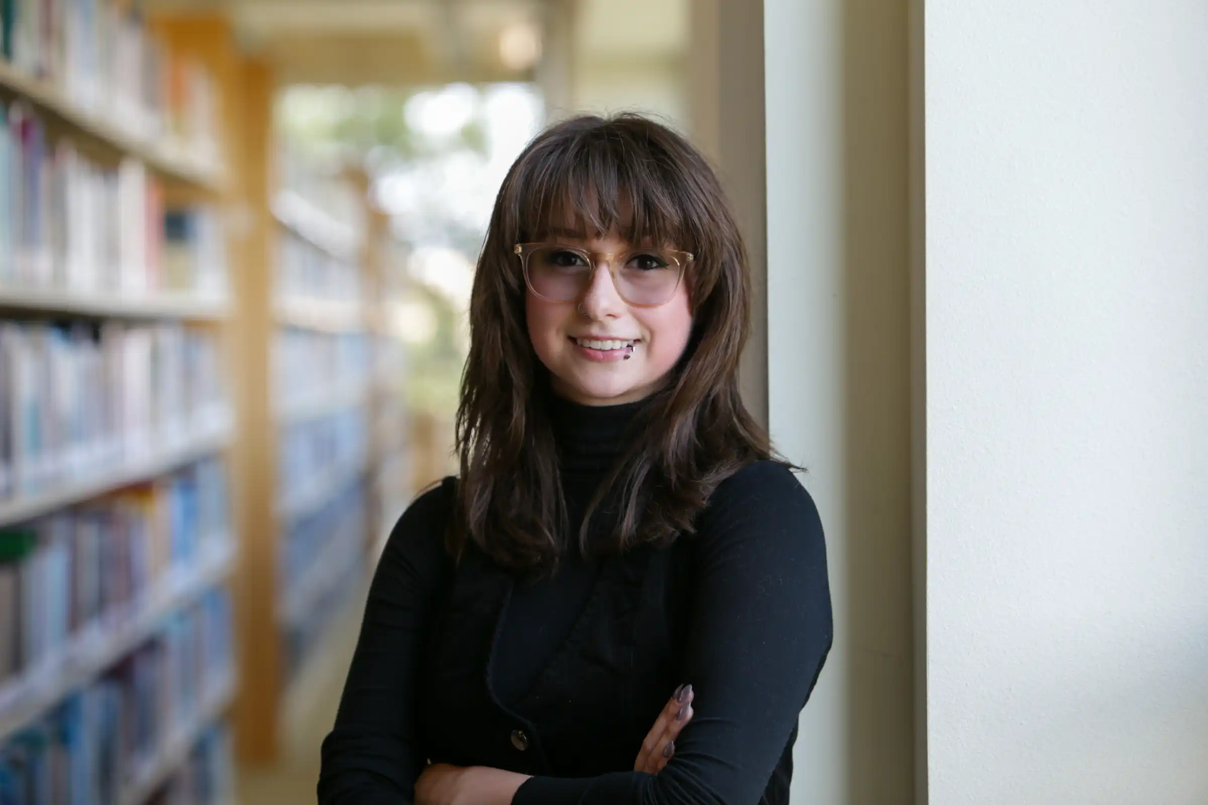 Alexa Nease in a library.