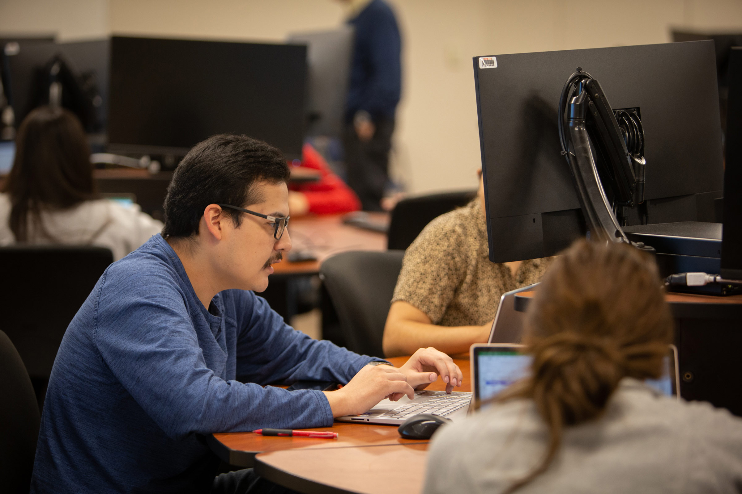 UTPB student working on computer in computer lab