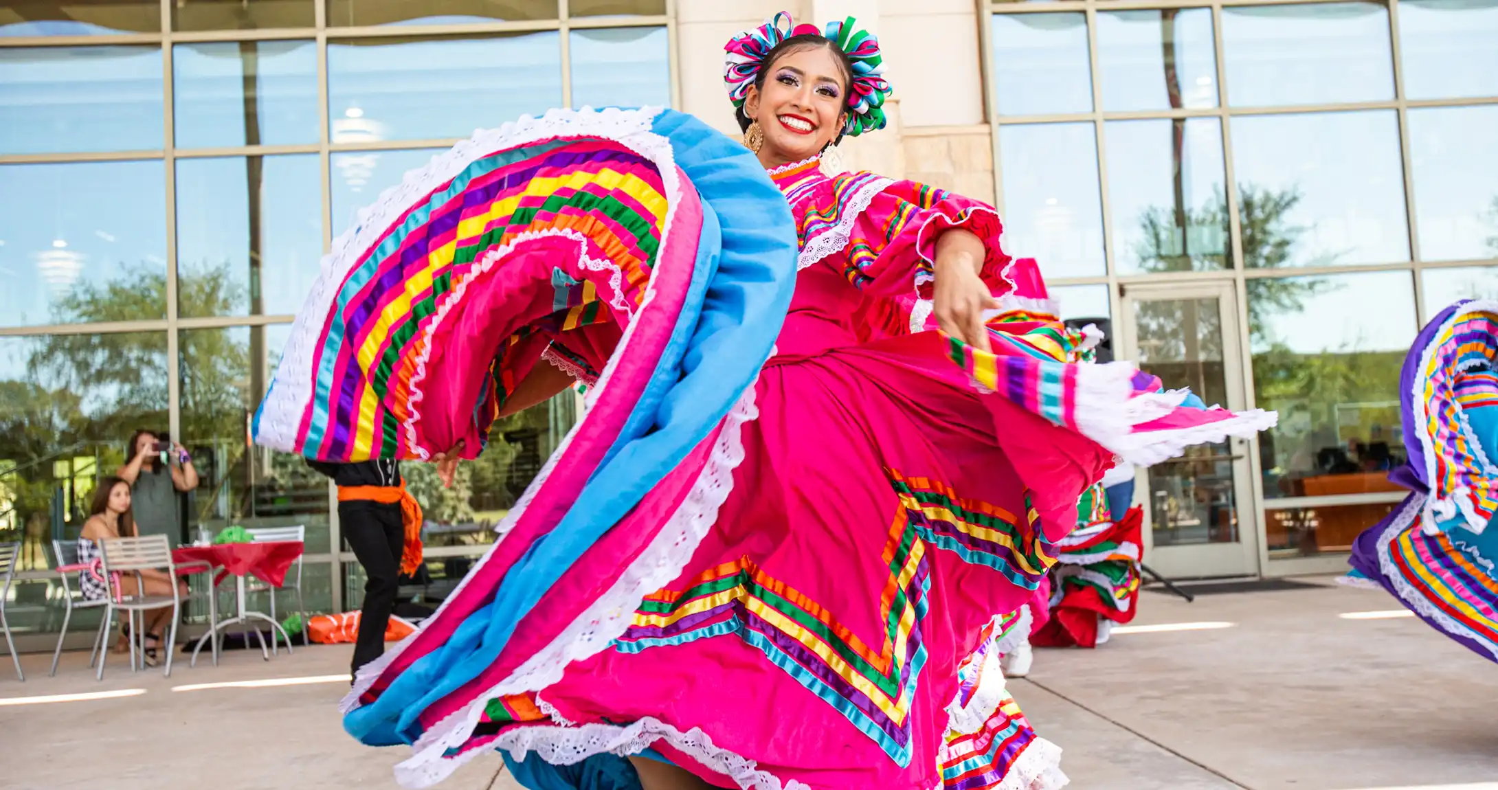 Dancer in a colorful dress performs folklórico at UT Permian Basin’s 2021 Hispanic Heritage celebration.