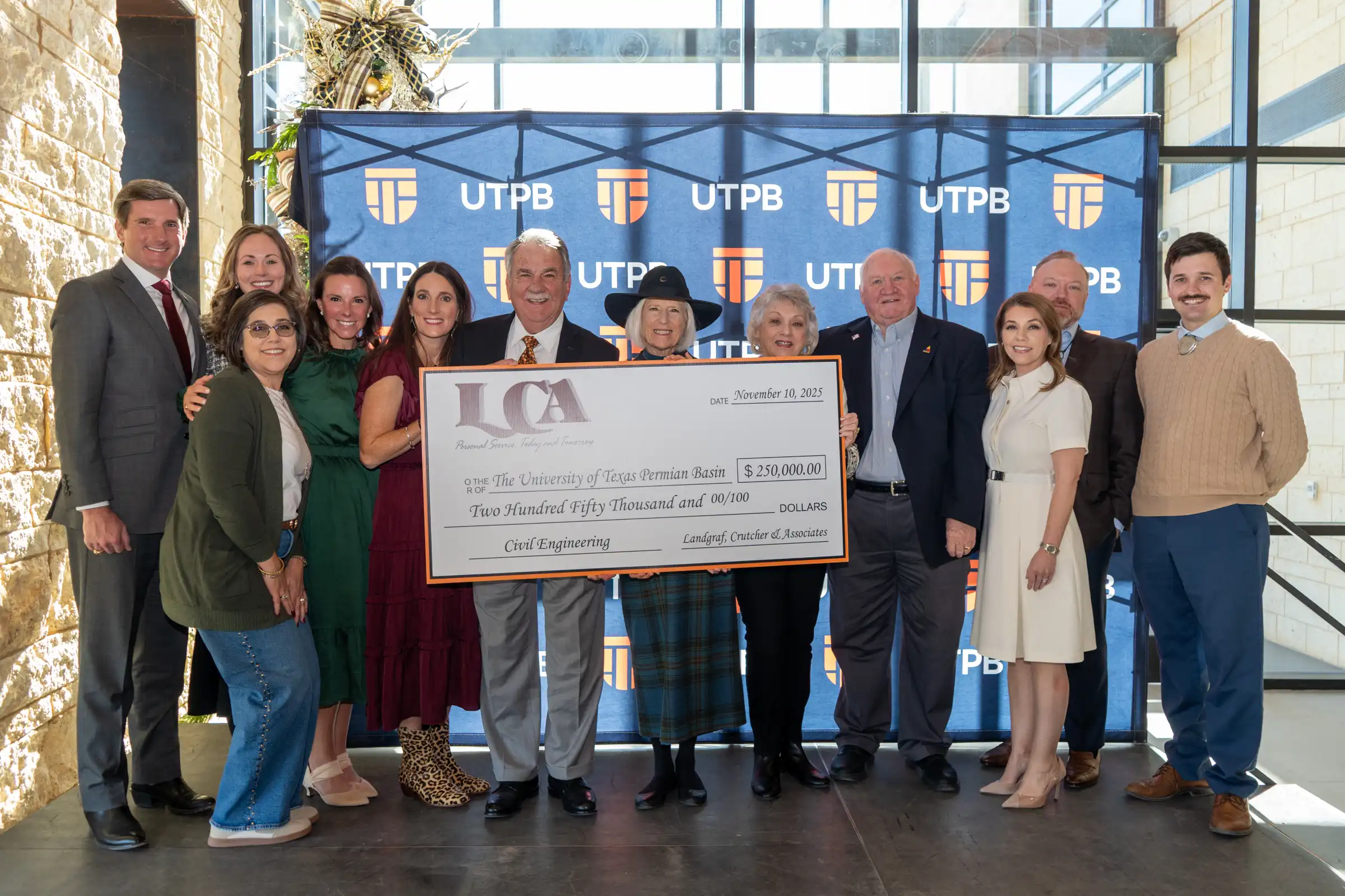 Landgraf, Crutcher & Associates team and family members presenting UTPB with $250,000 gift. 