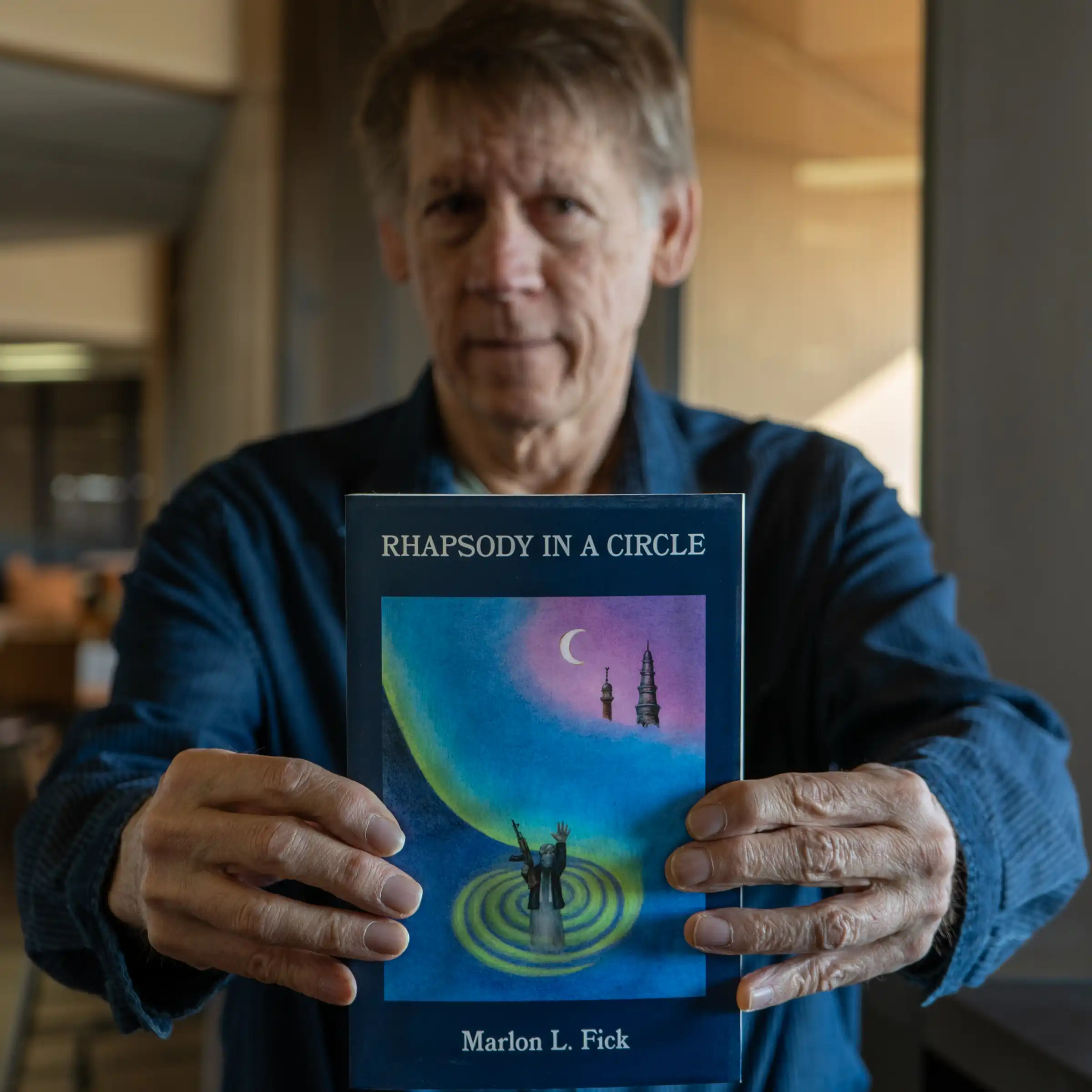 Marlon Fick with Book, Rhapsody in a Circle