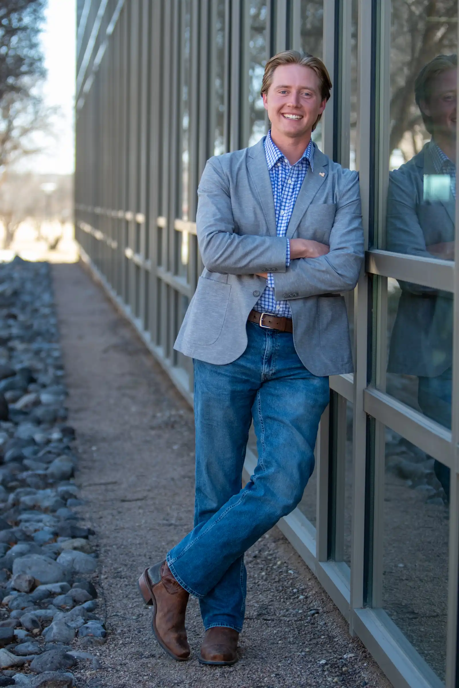 Parker Goin posed against the UTPB library window