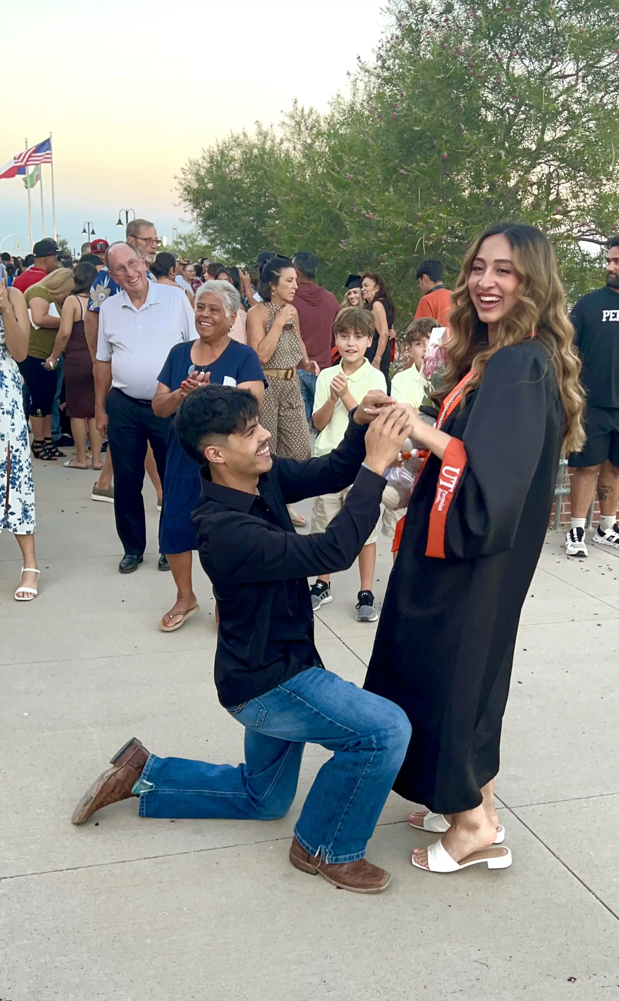 Matthew proposing to Alex at UTPB commencement. 