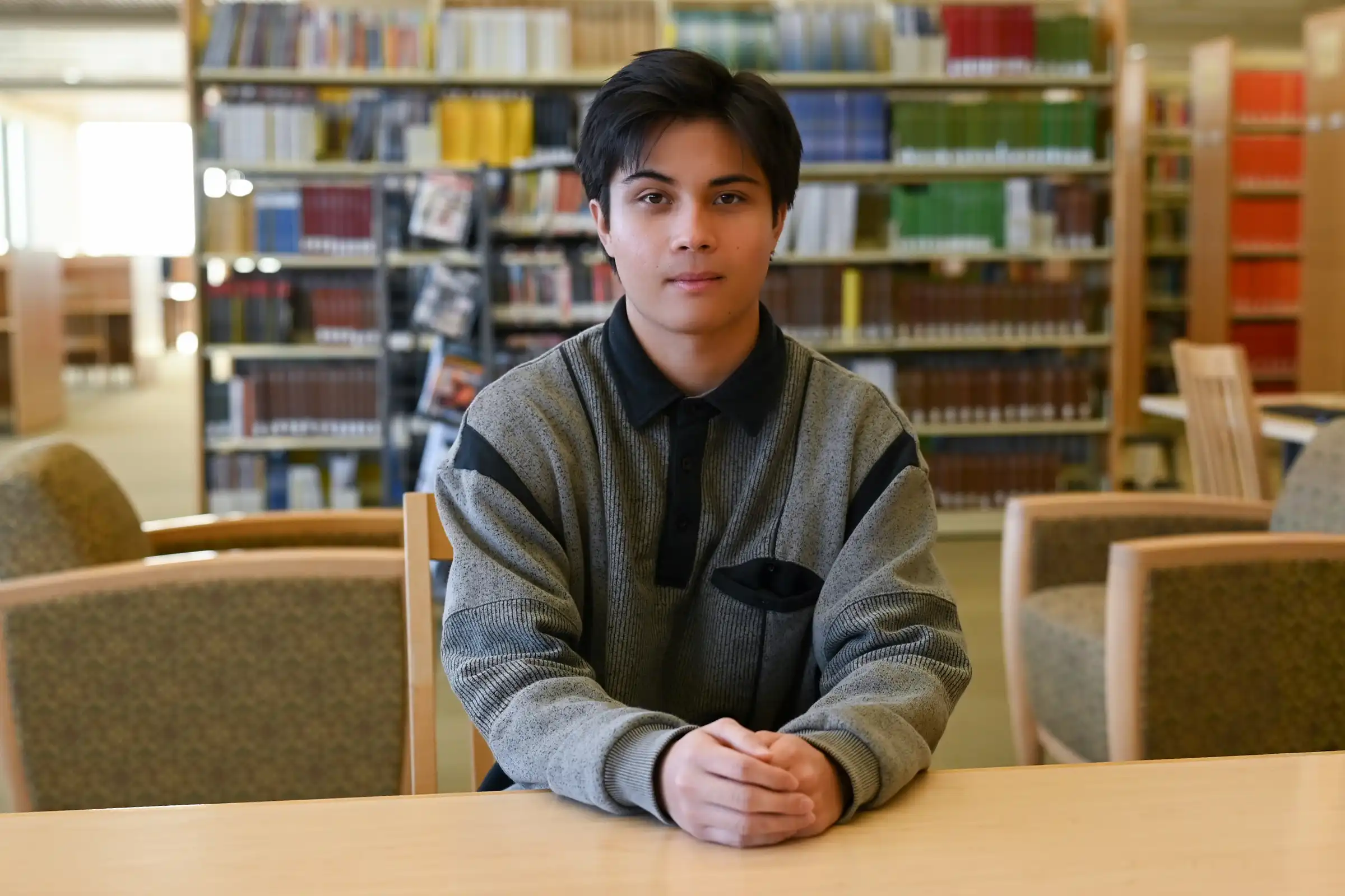 Brett Jacobsen in UTPB's on-campus library. 