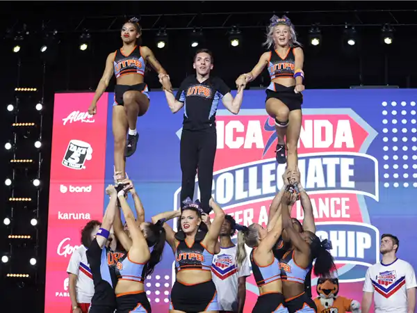 The UTPB Cheer team in a pyramid position during their performance at the collegiate NCA national championships.