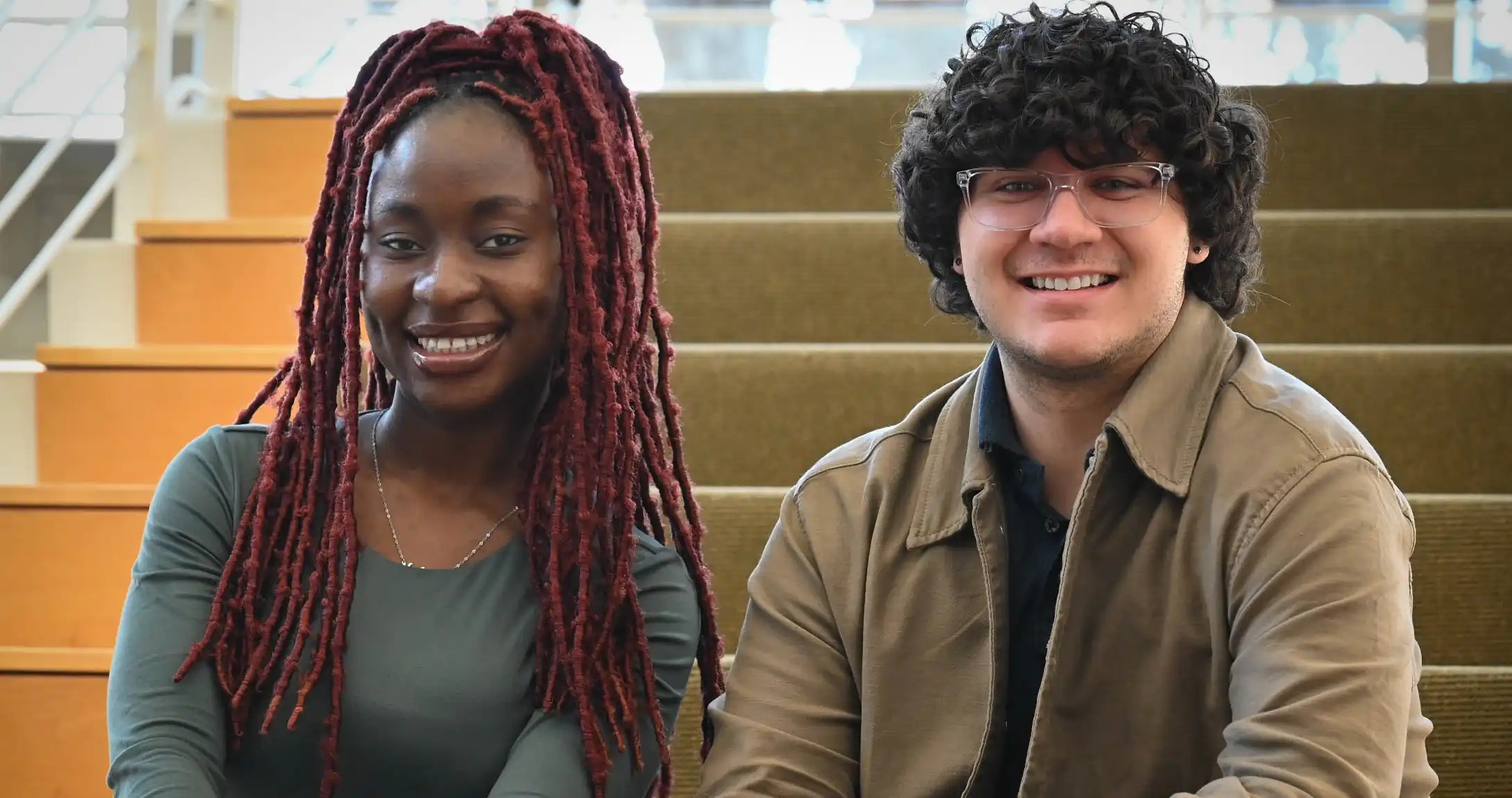 A UTPB graduate student, Halimat Popoola, sitting next to a UTPB grad, Phillip Driscoll, in the on-campus library. 
