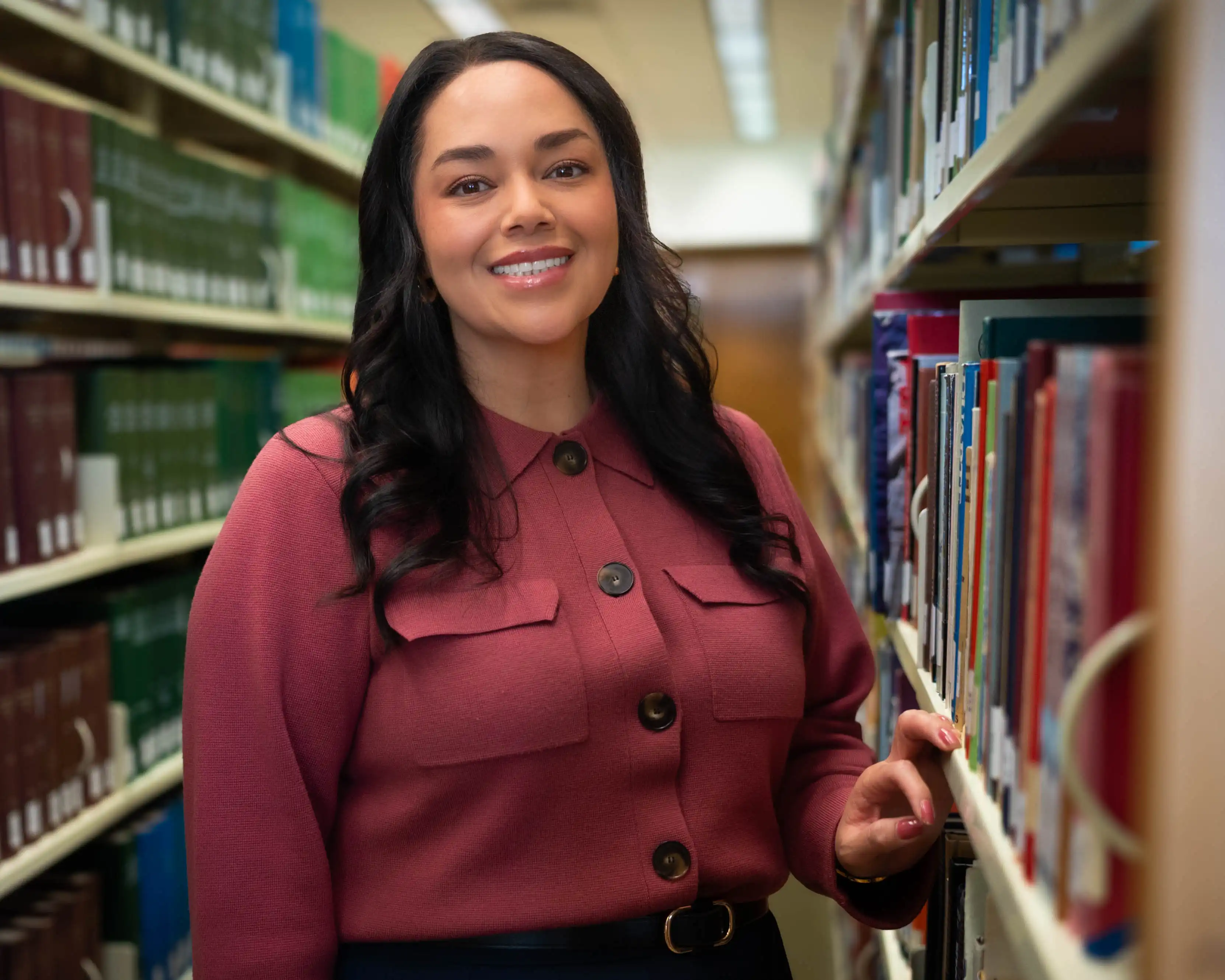 UTPB's Iris Fierro standing in the UTPB library. 