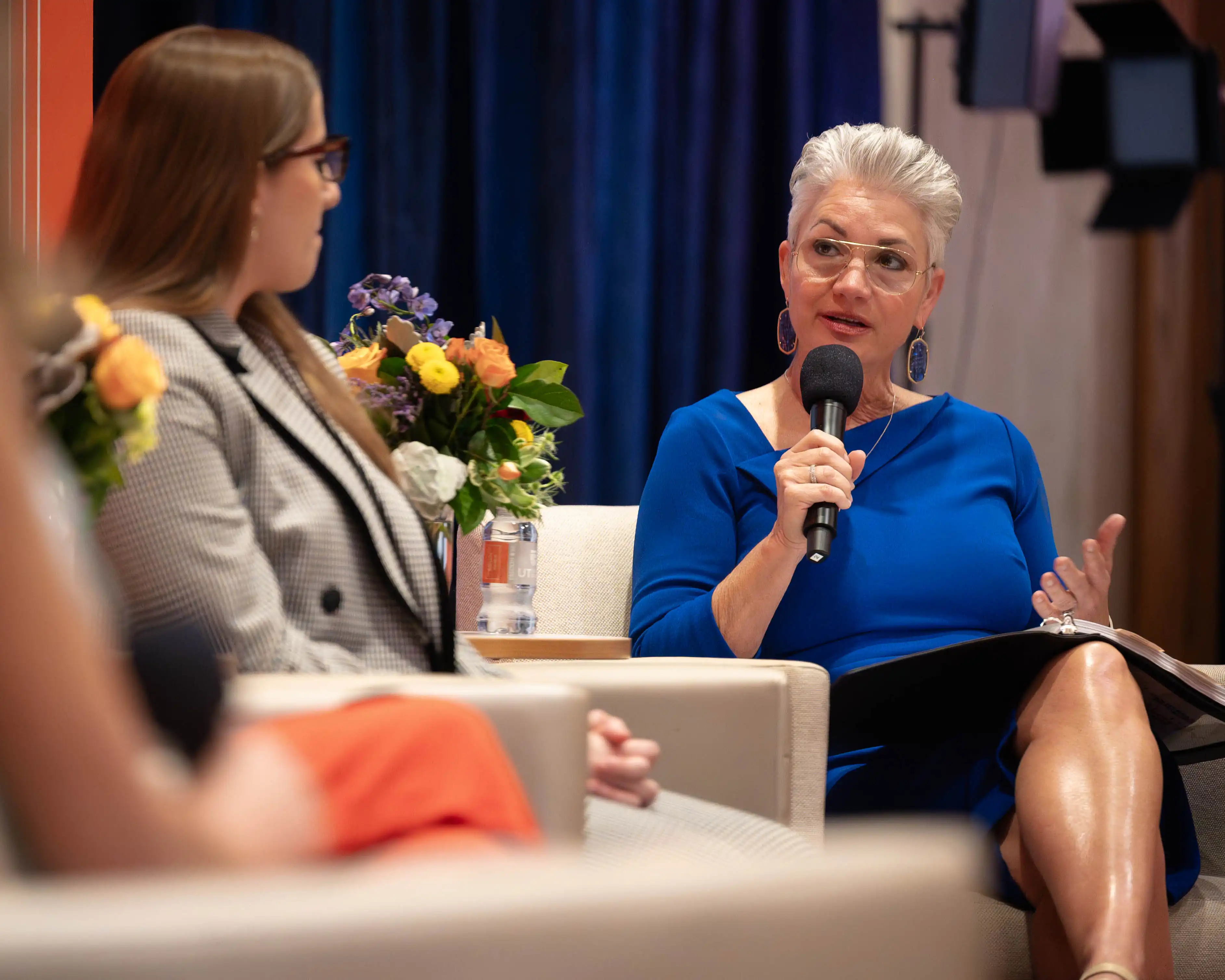 Dr. Woodley asking a UTPB student questions during a State of the University panel. 