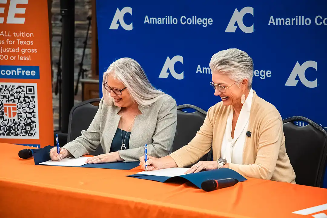 Dr. Jamelle Conner, Amarillo College President, and Dr. Sandra Woodley, UTPB President, signing the partnership. 