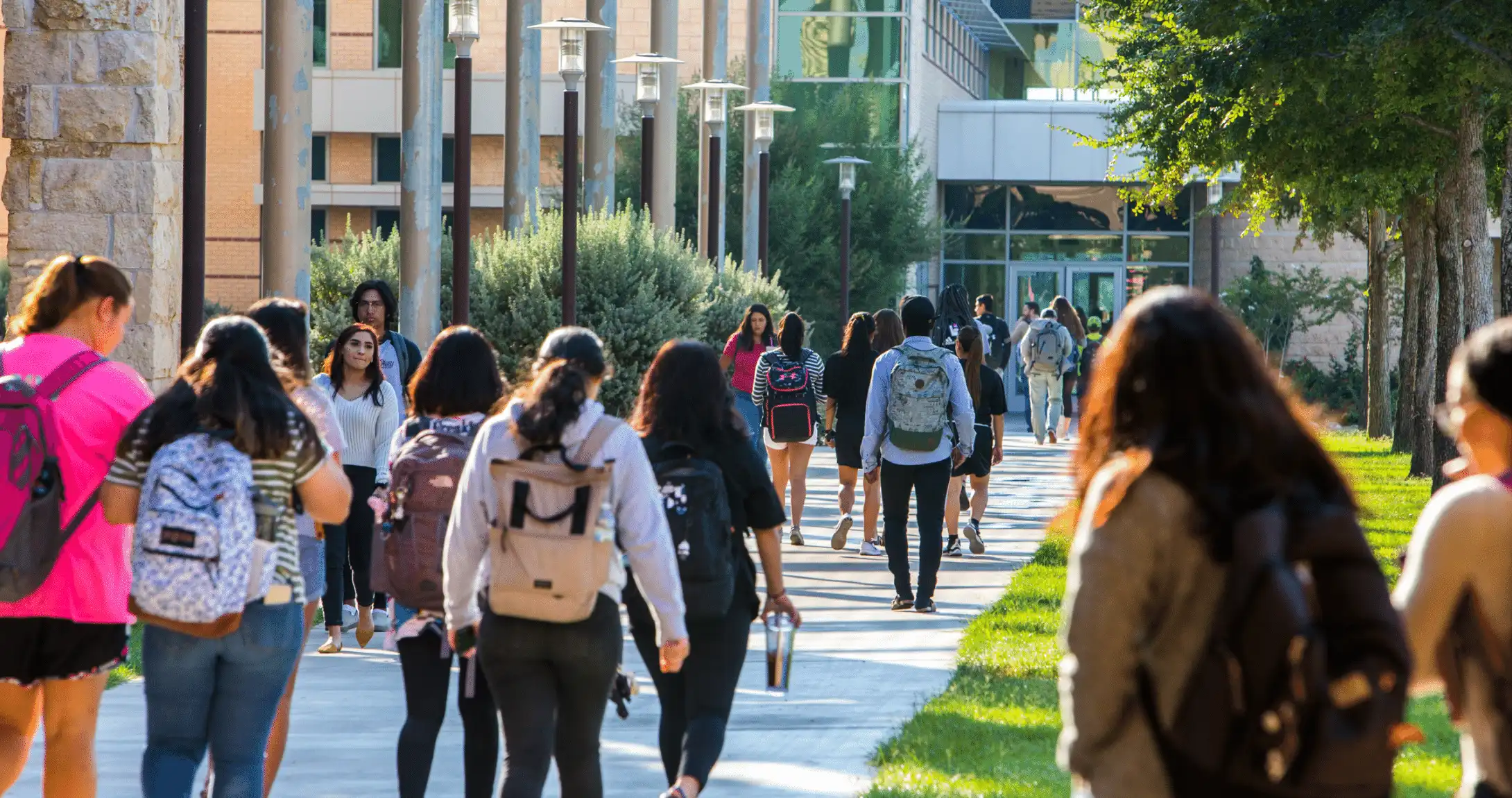 Students walking on campus in courtyard