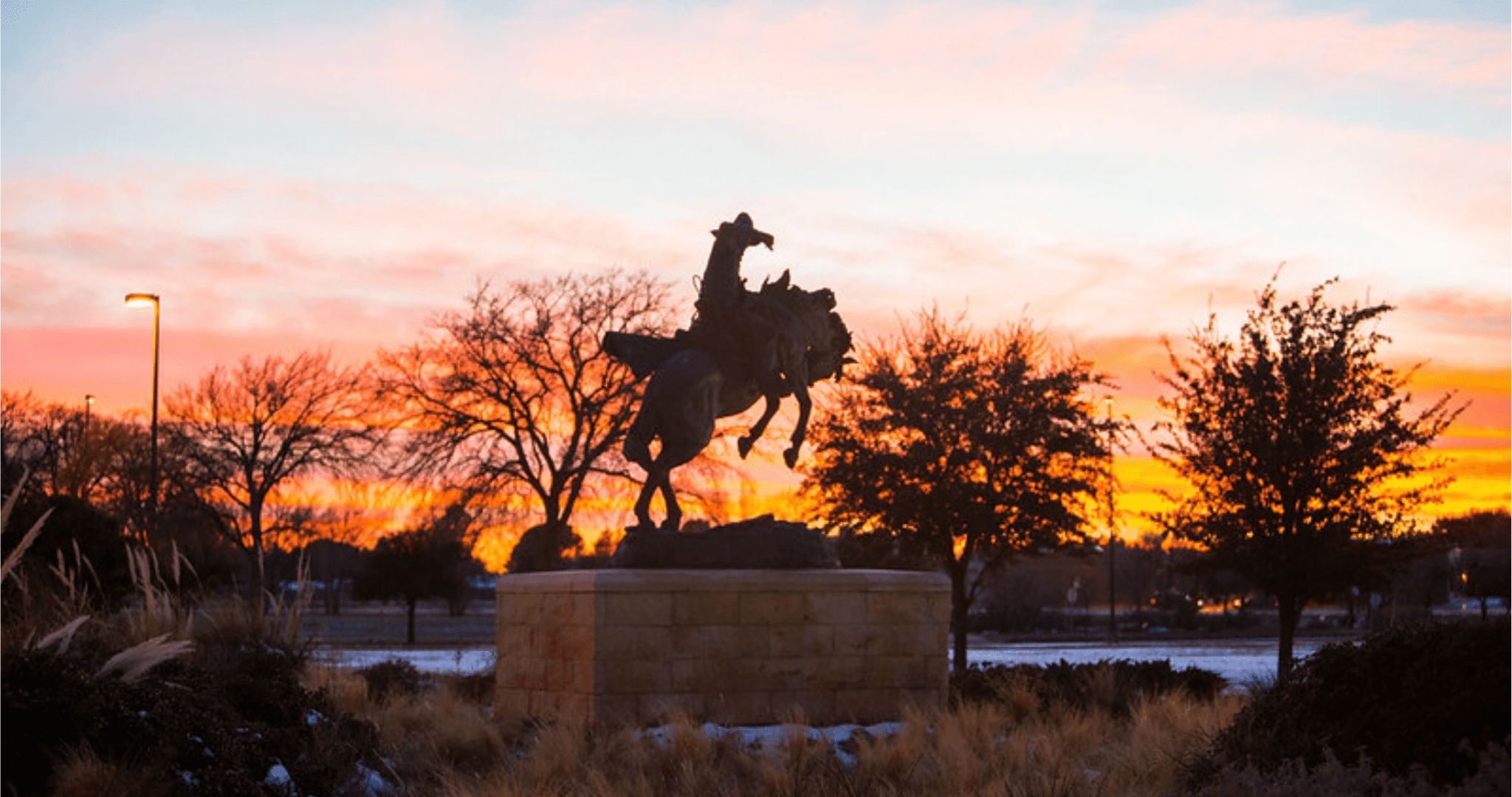 sun setting over campus