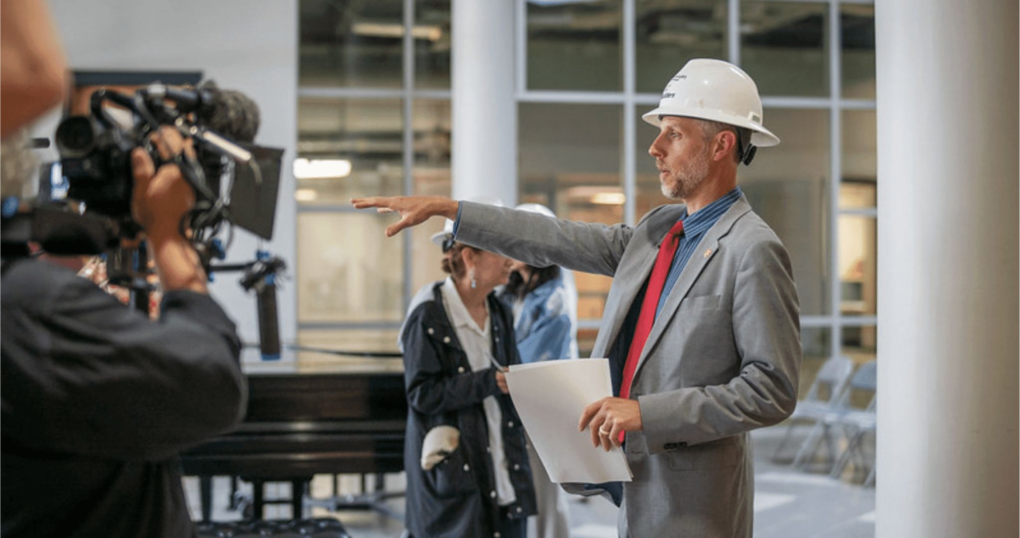 Employee giving tour of construction