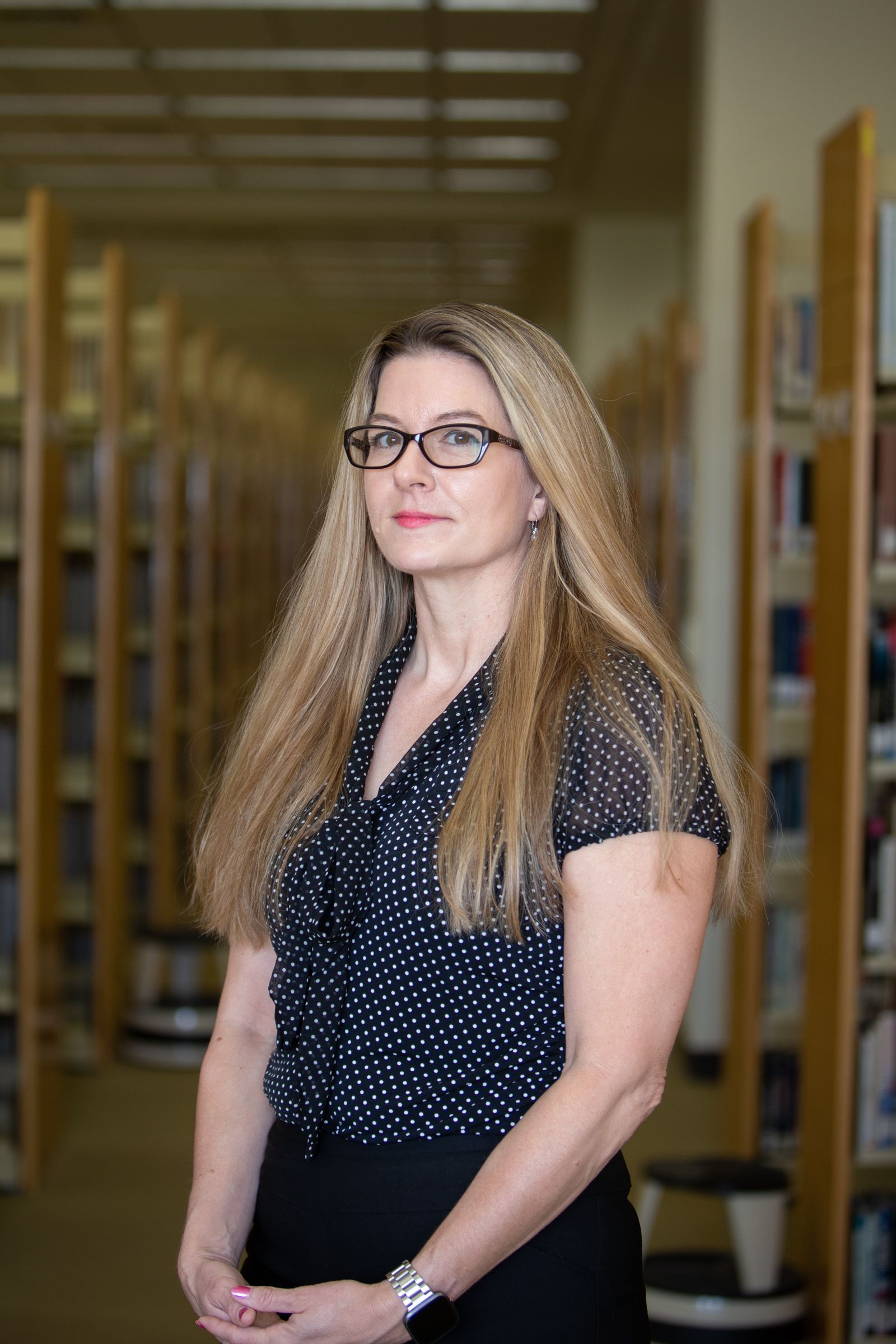 Dr. Jackson posing at library