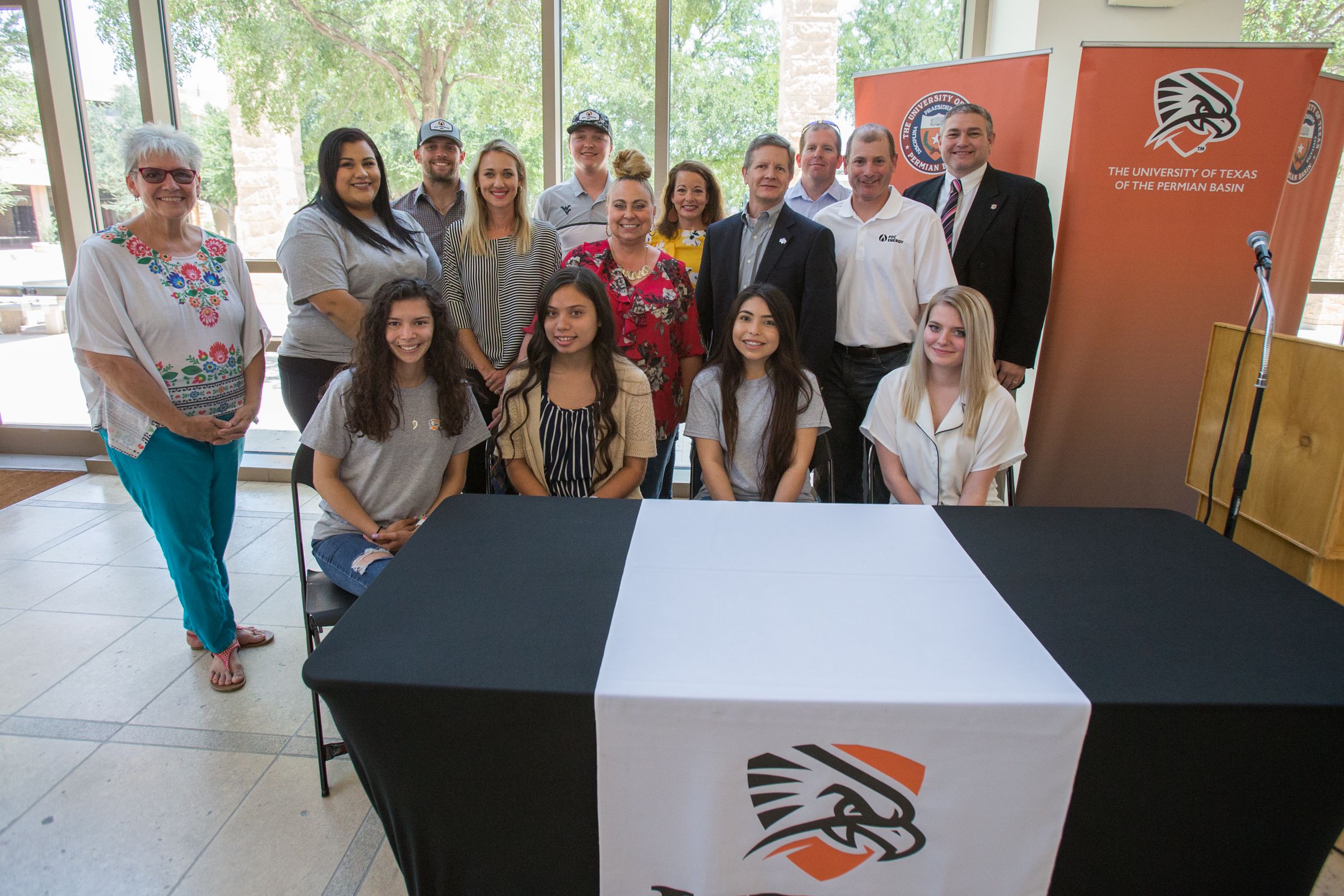 Students and Faculty smiling at College of Education event