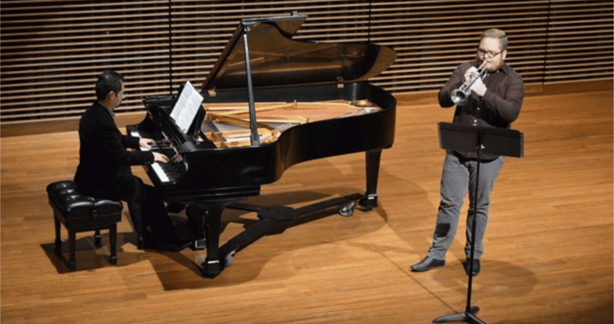 people playing the piano and trumpet