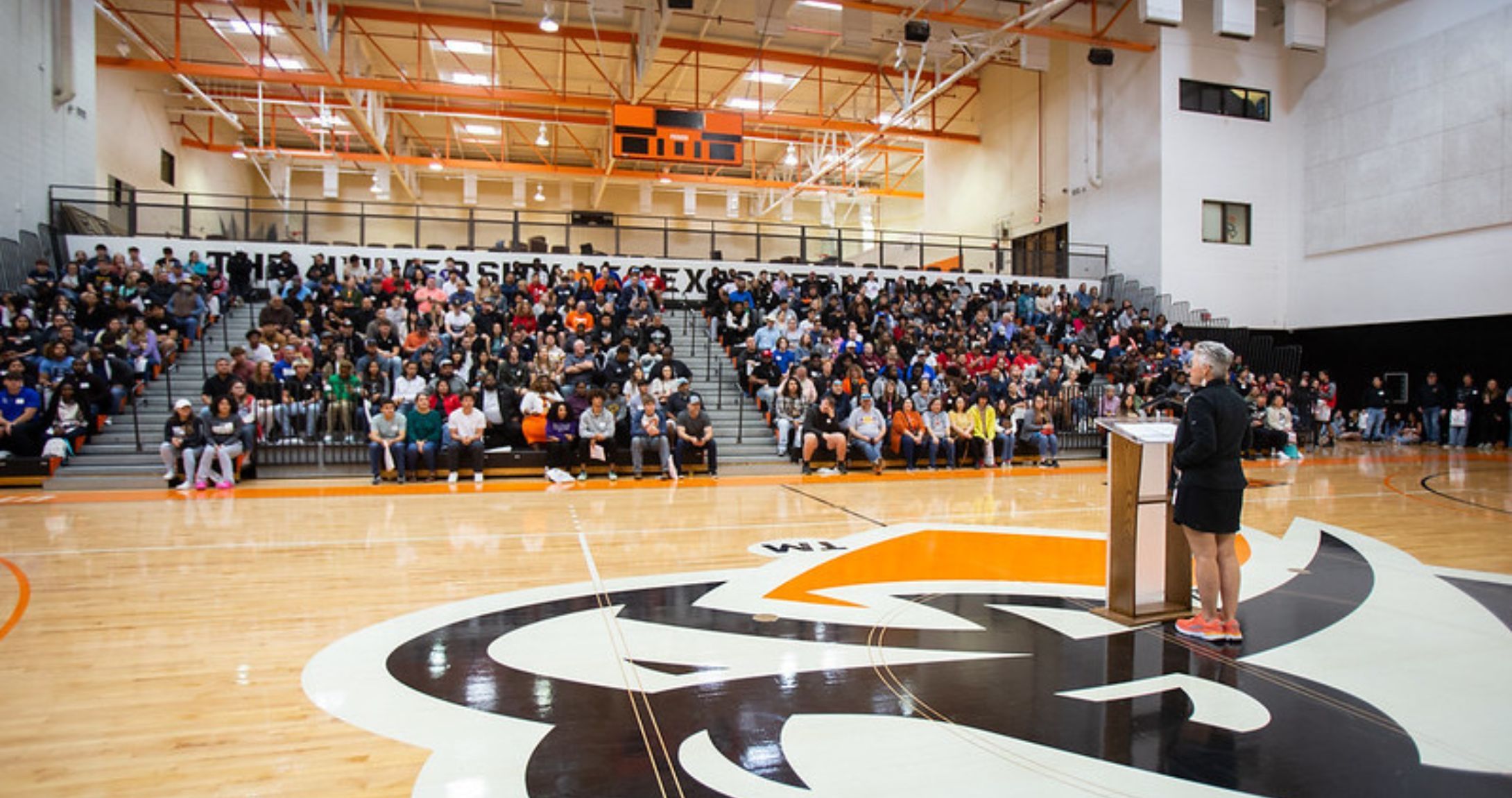 Students in stands at gym