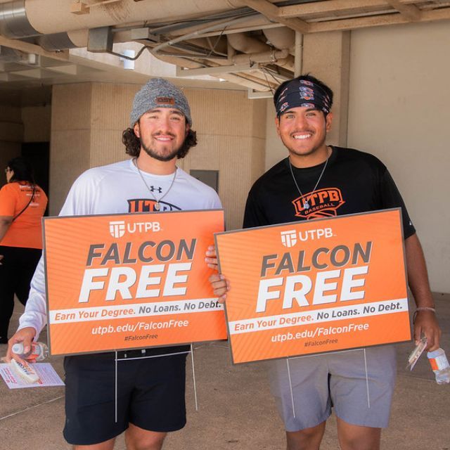 students smiling with falcon free sign