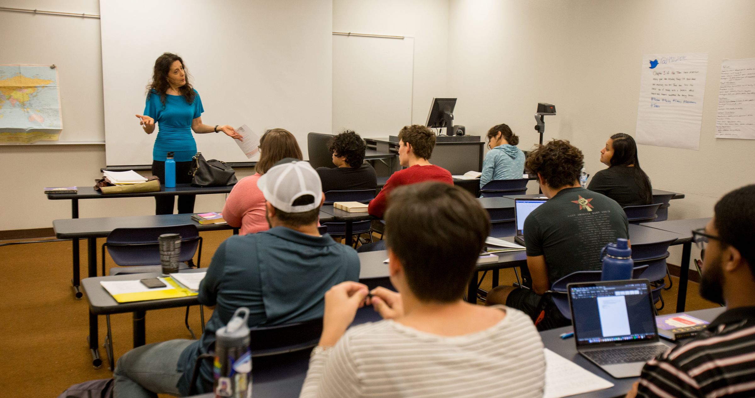 students in class listening to professor speak