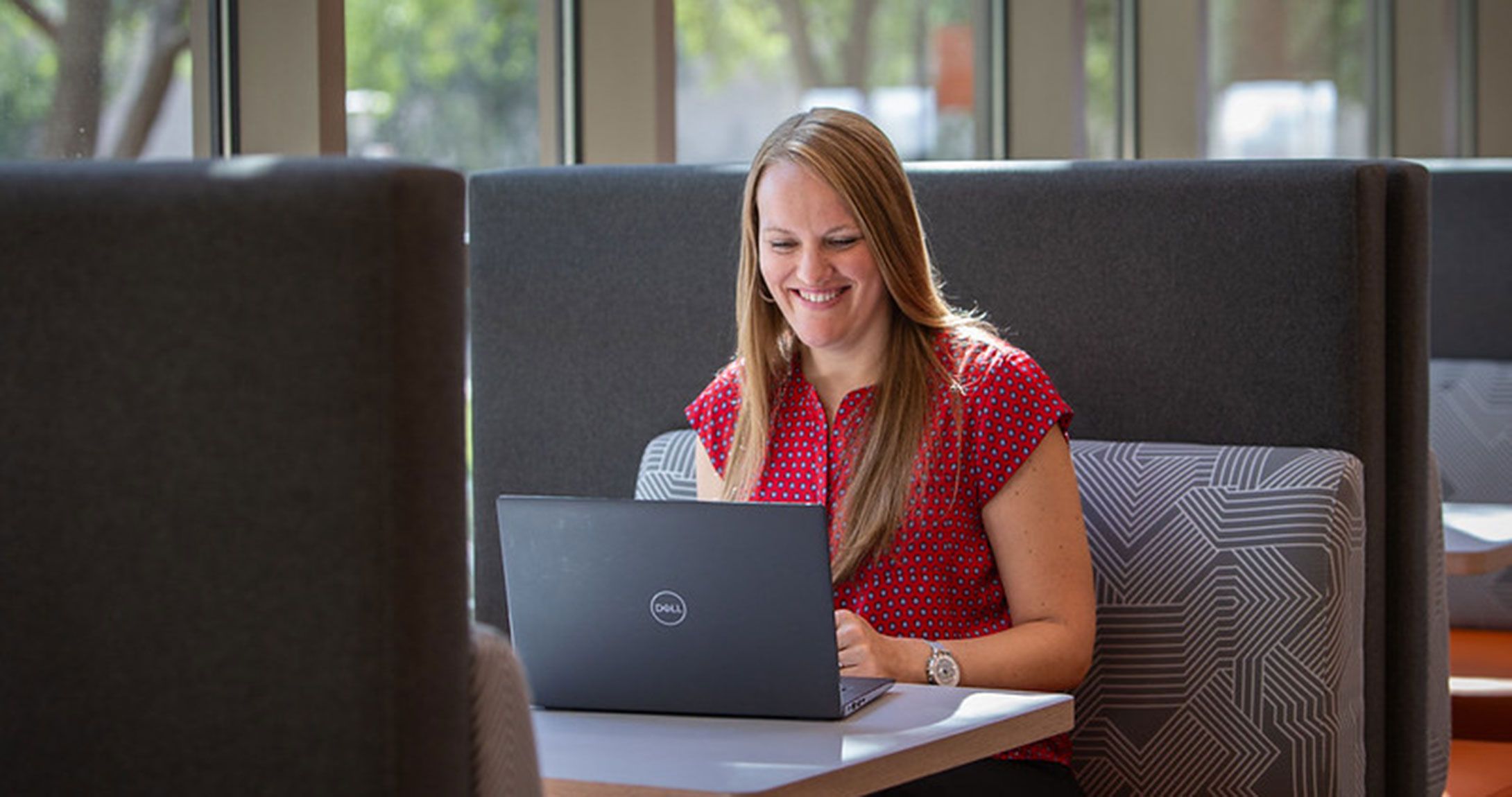 Professor smiling while on computer call