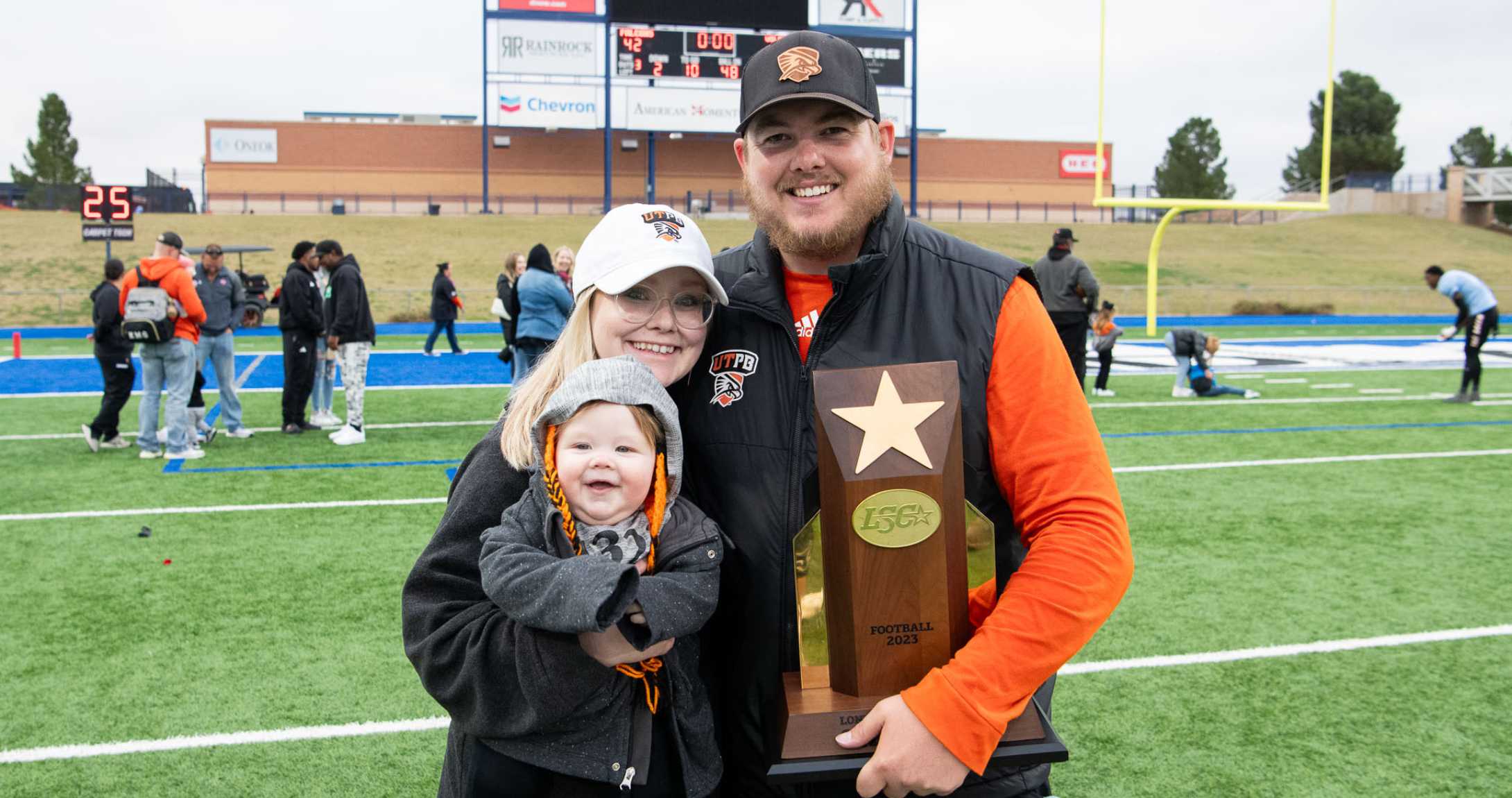 Kris McCullough smiling with family
