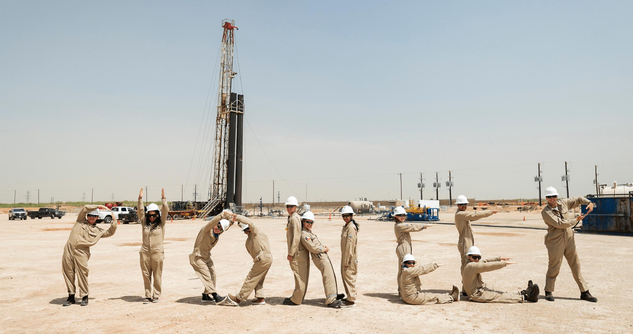 Nolan Hines and other interns spelling out Pioneer with their bodies