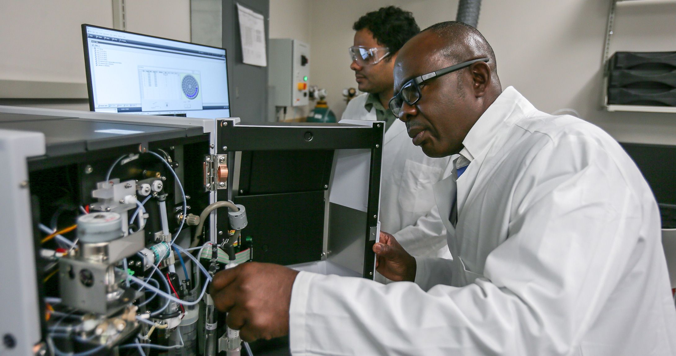 Director of Texas Water in Energy Institute, Dr. Nnanna, working in lab