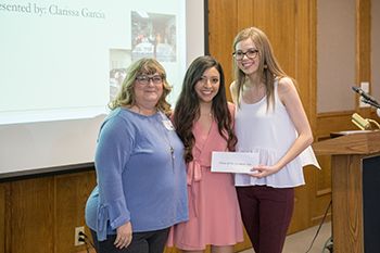 Student organization presenting check to non-profit